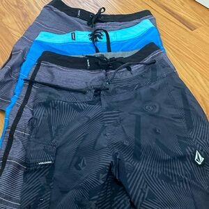 Boys swim trunks x4 size 14/27 Hurley and volcom
